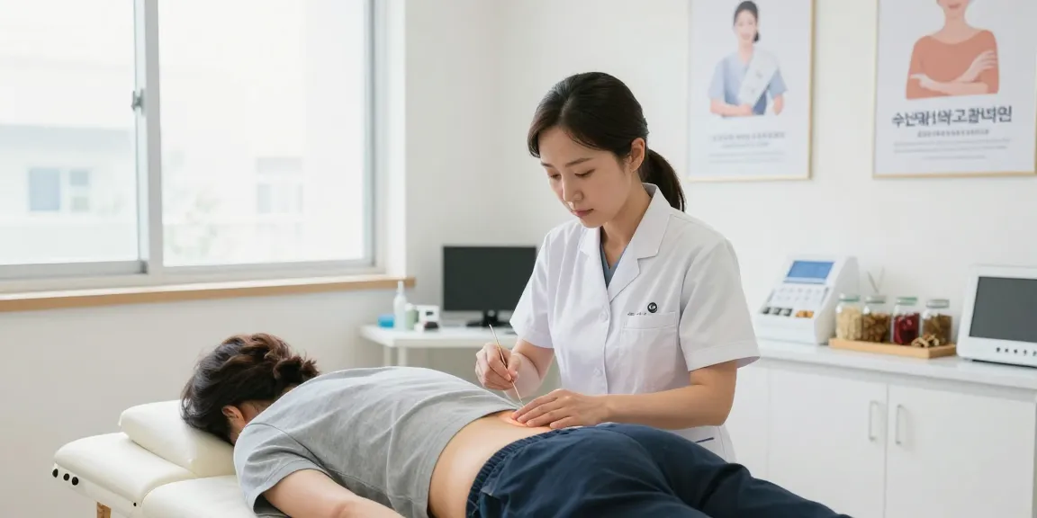 Expert treatment session at 수원교통사고한의원 showing a caring acupuncturist helping a patient recover from injury.